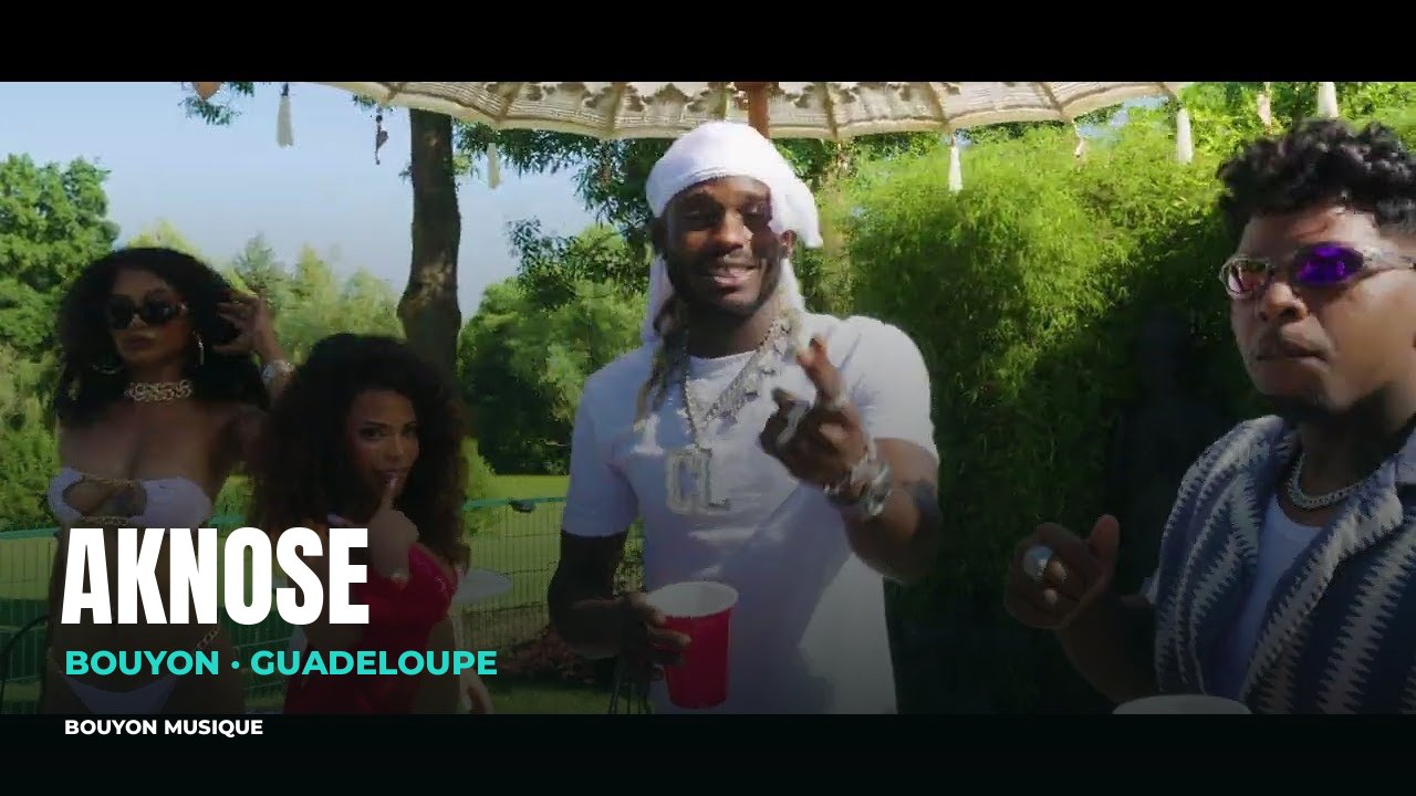 Aknose, bouyon artist from Guadeloupe: still from the video “AKNOSE ft KIMA ft Magistral - Coulie Coulie (Clip Officiel)” · Aknose · bouyon · bouyon music · musique bouyon · Aknose bouyon · Aknose music · Aknose musique · Aknose photo · Aknose photos · Aknose picture · Aknose images · Aknose artiste · Aknose artist · Guadeloupe · Aknose Guadeloupe · bouyon Guadeloupe
