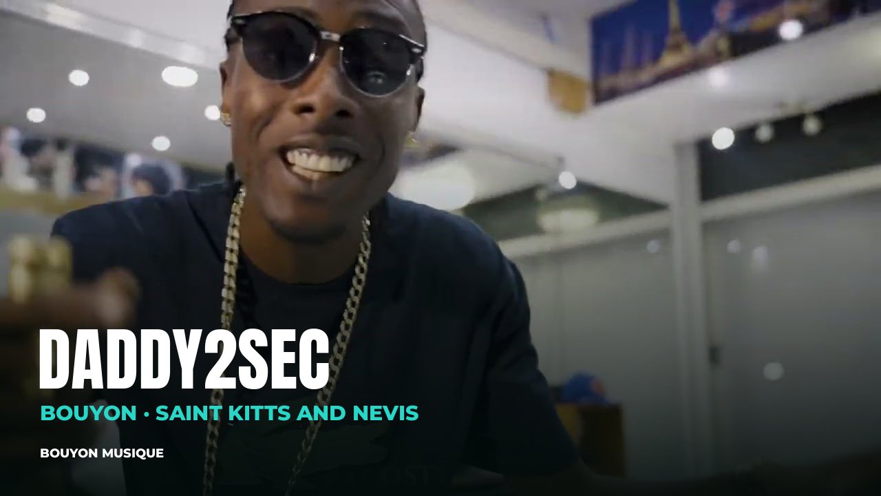 Daddy2Sec, bouyon artist (Saint Kitts and Nevis): still from the video “Daddy2Sec x DJTaffy - Check ur Scene (Official Music Video) | St.Kitts Bouyon 2026.” · Daddy2Sec · bouyon · bouyon music · musique bouyon · Daddy2Sec bouyon · Daddy2Sec music · Daddy2Sec musique · Daddy2Sec photo · Daddy2Sec photos · Daddy2Sec picture · Daddy2Sec images · Daddy2Sec artiste · Daddy2Sec artist · Saint-Christophe-et-Niévès · Daddy2Sec Saint-Christophe-et-Niévès · bouyon Saint-Christophe-et-Niévès